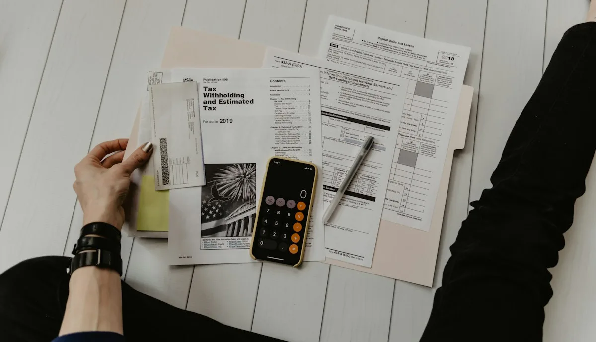 GST and income tax return filing documents with calculator