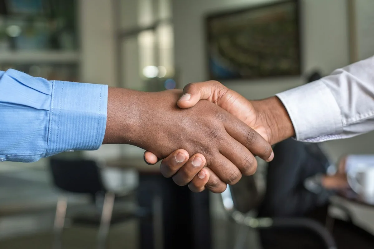 Handshake between client and business consultant after successful compliance consultation